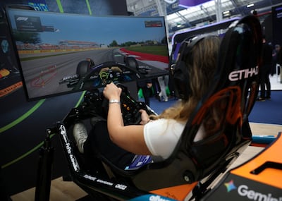 A visitor plays a VR racing experience by the McLaren Formula 1 Team during London Tech Week at Olympia on June 8. Reuters