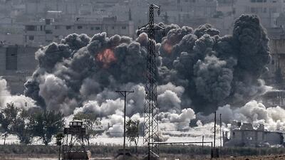 Taken from the Turkish border near the southeastern village of Mursitpinar, this picture shows smoke billowing after a fighter jet hit Kobani on October 28, 2014. Turkey wants the anti-Assad Free Syrian Army (FSA) to control Kobani if if ISIL is defeated, and not the forces of separatist Kurds or President Bashar al-Assad, Prime Minister Ahmet Davutoglu said. AFP Photo