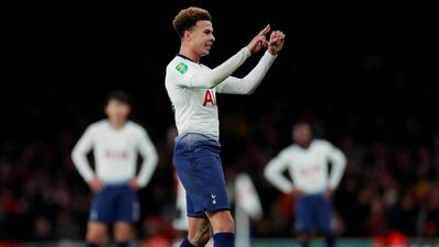 Tottenham's Dele Alli gestures to the Arsenal fans during their League Cup match. Reuters