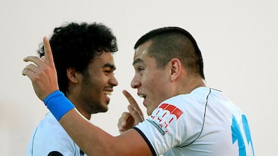 Carlos Munoz of Baniyas celebrates with his teamate Haboush Saleh. Satish Kumar / The National