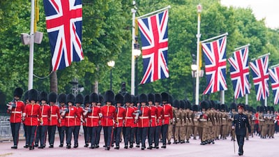 Troops march on The Mall. PA