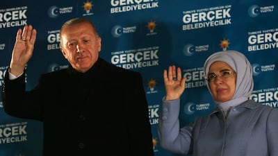 Turkish President and leader of Justice and Development Party Recep Tayyip Erdogan with his wife Emine Erdogan after the local elections in Ankara. AFP