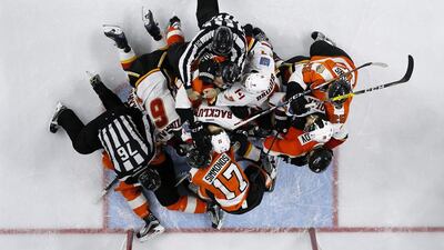 Referees try to break up a fight between the Philadelphia Flyers and the Calgary Flames on November 27, 2016, in Philadelphia, home of Rocky Balboa. Matt Slocum / AP