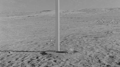 Above, a desert crossroads point to Abu Dhabi and Buraimi; its obscured faces point to Tarif and Dubai. At right, camel riders from the Trucial Oman scouts on patrol near Al Ain in 1963.