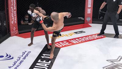 Ahmed Al Darmaki strikes at Kagimu Kigga. Courtesy UAE Warriors