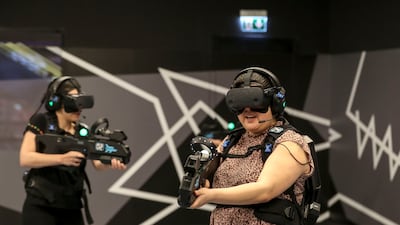 Players have fun at the virtual reality entertainment venue, Zero Latency at Abu Dhabi's Galleria Mall. Khushnum Bhandari / The National