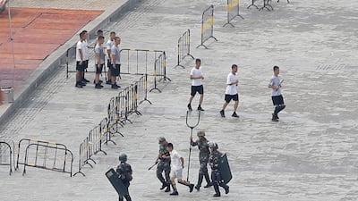 Chinese servicemen attend a crowd control exercise. Reuters