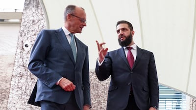 German Chancellor Friedrich Merz, left, welcomes Syrian President Ahmad Al Shara at the Chancellery in Berlin. Reuters