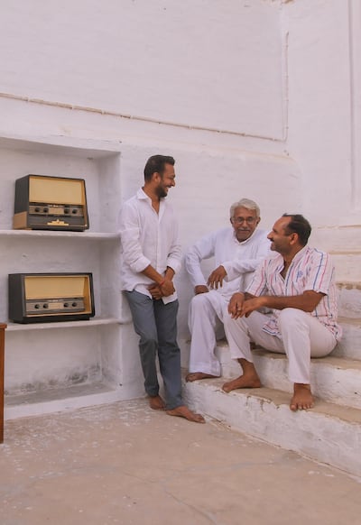 From, left, Diwik Singh Chhalani, Ustad Mainuddin and Manoj Suthar. The craftmen work on modernising old radios. Photo by Niral Naik