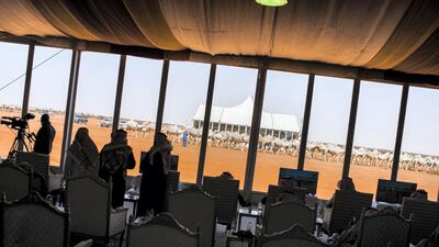 Camel owners watch as their camels are judged by a jury during a beauty contest. Maxime Fossat for The National