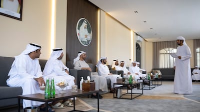 Sheikh Mohamed bin Zayed, Crown Prince of Abu Dhabi and Deputy Supreme Commander of the Armed Forces (3rd L) listens to a poem during a visit to the home of Dr Omar Habtoor Al Derei, Director General of the UAE Fatwa Council (4th L). Seen with Hamad Habtoor Al Derei (2nd L) and Sheikh Mohammed bin Hamad bin Tahnoon, adviser for Special Affairs at the Ministry of Presidential Affairs (5th L) and other dignitaries.