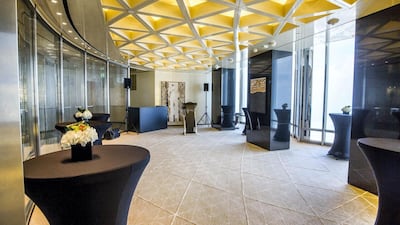 The three different storeys of The Lounge each have a different feel: the first floor has majlis style coffee tables and couches, while the top floor has cocktail tables only. Photo: Leslie Pableo for The National