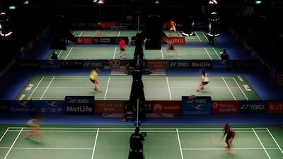 Athletes compete in the first round of the Australian Badminton Open in Sydney, Australia. Picture taken with slow shutter speed. Jason Reed / Reuters