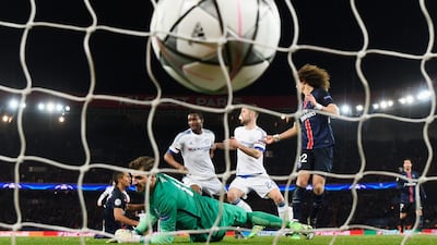 John Mikel Obi of Chelsea scores their first and equalising goal past goalkeeper Kevin Trapp of Paris Saint-Germain during the UEFA Champions League round of 16 first leg match between Paris Saint-Germain and Chelsea at Parc des Princes on February 16, 2016 in Paris, France. (Photo by Mike Hewitt/Getty Images)