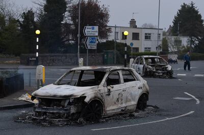 One of the cars destroyed cars in the violence. Getty