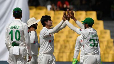 Naseem Shah celebrates with teammates after dismissing Nathan Lyon. AFP