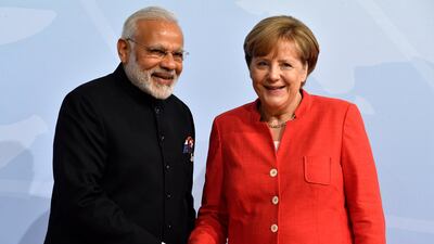 Mrs Merkel with India's premier Nardendra Modi. John MacDougall / AFP Photo