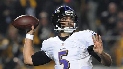 Baltimore Ravens quarterback Joe Flacco rears back to throw a pass against the Pittsburgh Steelers in the NFL play-offs on Saturday. Don Wright / AP / January 3, 2015