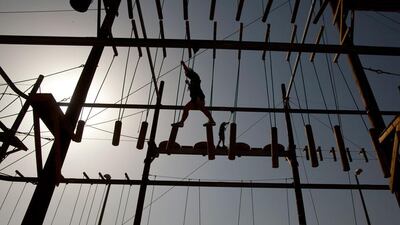 An adventure seeker on the 'Air Park' at Wadi Adventure in Al Ain. Christopher Pike / The National