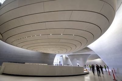 The museum interior is designed with rounded edges and features globular structures. Victor Besa / The National