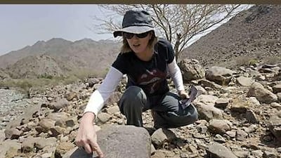 Dr Michele Ziolkowski points to one of the many petroglyphs she has discovered in Wadi Al Hayl in Fujairah. Right, petroglyphs from the Iron Age, between 1300 and 300BC.