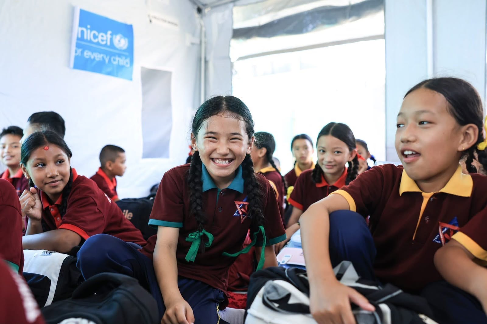 Pupils say they are happy to meet their friends in school as most have lost their homes and belongings in the devastating August floods. Photo: Rajendra Dawadi