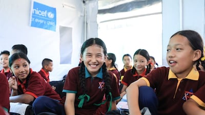 Pupils say they are happy to meet their friends in school as most have lost their homes and belongings in the devastating August floods. Photo: Rajendra Dawadi