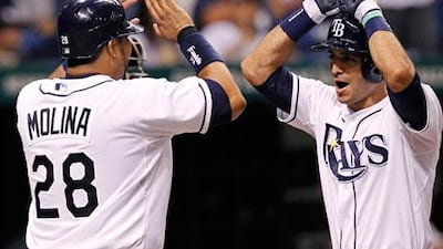 Tampa Bay Rays' Sean Rodriguez is congratulated on his home run against the Yankees