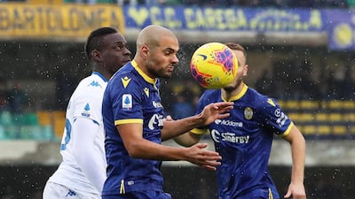 Verona's Alan Empereur in action against Brescia's Mario Balotelli. EPA