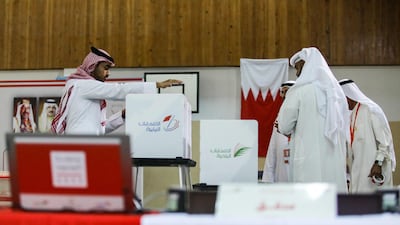 Clerks prepare ballot boxes at a polling station on the island of Muharraq, north of Manama.