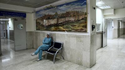A nurse sits outside the obstetrics and gynaecology ward at Al Makassed Hospital in East Jerusalem. UAE President Sheikh Mohamed has pledged $25 million for the hospital. AFP