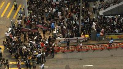 The journalists held the rare demonstration against Chinese authorities, after paramilitary police beat the Hong Kong journalists covering protests in Urumqi.