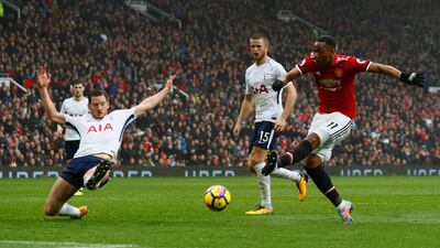 Manchester United's Anthony Martial, right, scores the only goal of the game in the win over Tottenham at Old Trafford. Jason Cairnduff / Reuters