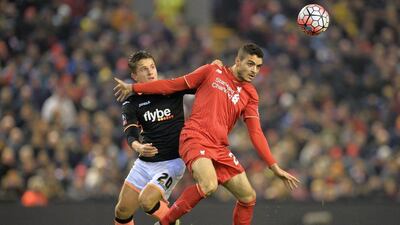 Liverpool’s Tiago Ilori holds off an Exeter striker during their FA Cup contest on Wednesday night. Paul Ellis / AFP