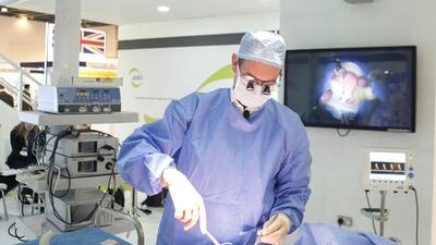 Cardiac surgeon Dr Ulrich Rosendahl performs a live simulation of a heart surgery. Reem Mohammed for The National