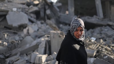 A Palestinian woman surveys the devastation after an Israeli air strike in Rafah. Reuters