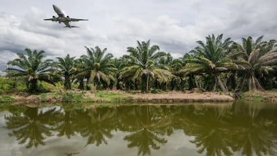 A Malaysia Airlines heading to the Kuala Lumpur International Airport. The carrier will use space-based tech to track its aircraft. Mohd Rasfan / AFP