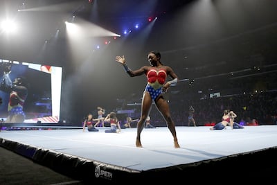 Dressed as Wonder Woman, Simone Biles performs during the Gold Over America Tour. AFP