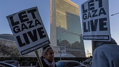 Pro-Palestinian demonstrators gather outside the UN headquarters in New York before members of the UN Security Council meet to vote on a draft resolution to authorise an International Stabilisation Force in Gaza last month. AFP