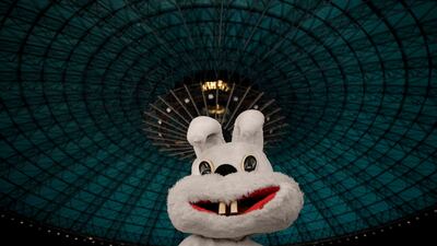 An entertainer wearing a rabbit costume amuses Ukrainian children on Maundy Thursday in a centre for refugees in Bucharest, Romania. AP Photo