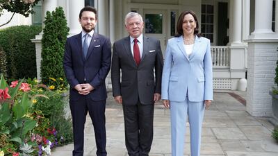 Jordanian King Abdullah II (C) accompanied by Crown Prince Hussein bin Abdullah (L) and US Vice President Kamala Harris at the Vice President's residence at the Naval Observatory in Washington.