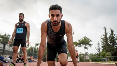 Lebanese sprinter Nour Hadid prepares in his newly donated running gear.