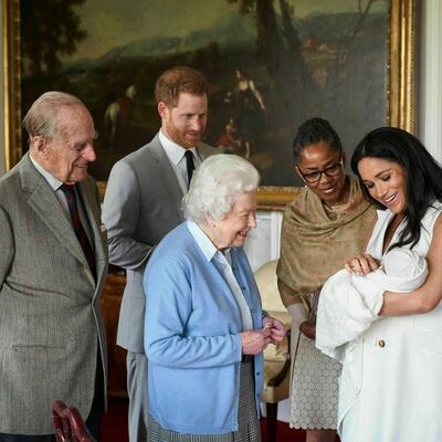 From left, Prince Philip, Prince Harry, Queen Elizabeth II, Doria Ragland and Meghan, Duchess of Sussex with newborn Archie in May 2019. AP