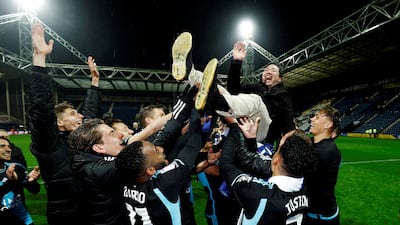 Leicester City plays toss chairman Aiyawatt Srivaddhanaprabha in the air as part of their title-winning celebrations. Reuters