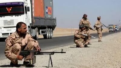Private security contractors guard a road used by Nato supply trucks in the province of Ghazni.