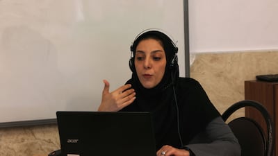 An Iranian teacher holds her class via webcam in Tehran on May 11. With the outbreak of war and insecurity, classes have been held remotely. AFP