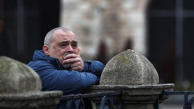 A man watches the site of Tuesday's explosion in the historic Sultanahmet district in Istanbul a day after a suicide bomber detonated a bomb in the heart of Istanbul's historic district killing 10 Germans. Lefteris Pitarakis/AP Photo