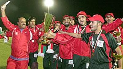 Oman cricketers celebrate their victory over the UAE in the final of the first Gulf Cup.