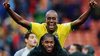 Caju, top, of Brazil celebrates with teammate Alef after winning their Fifa U-20 World Cup quarter-final against Portugal held at Waikato Stadium on June 14, 2015 in Hamilton, New Zealand. (Photo by Hannah Peters/Getty Images)