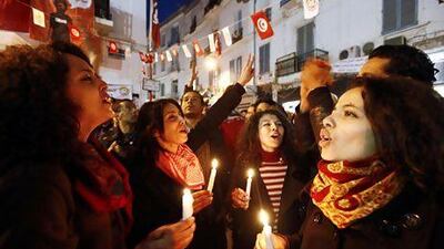 Artists hold candles during a demonstration outside the headquarters of the General Union of Tunisian Workers in Tunis. Anis Mili / Reuters